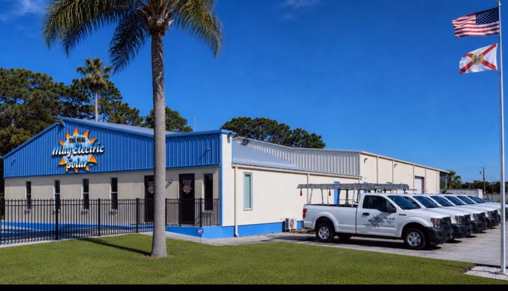 May Electric Solar's Hudson, FL headquarters alongside the company's fleet of service trucks